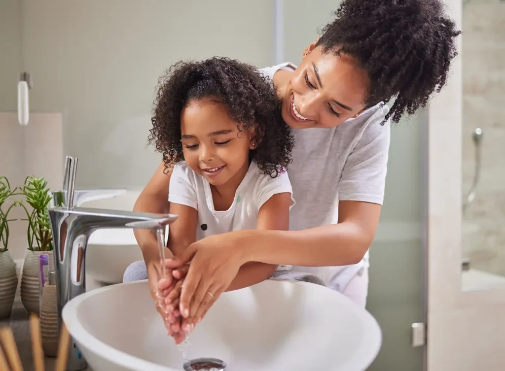 mother and daughter washing their hands in fresh, softened tap water springfield il